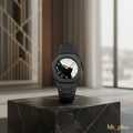 www.bhplus.shop black metal watch with a mother-of-pearl dial featuring Arabic numerals and gold hands.
