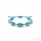 www.bhplus.shop blue shell charm bracelet with gold accents on adjustable cord