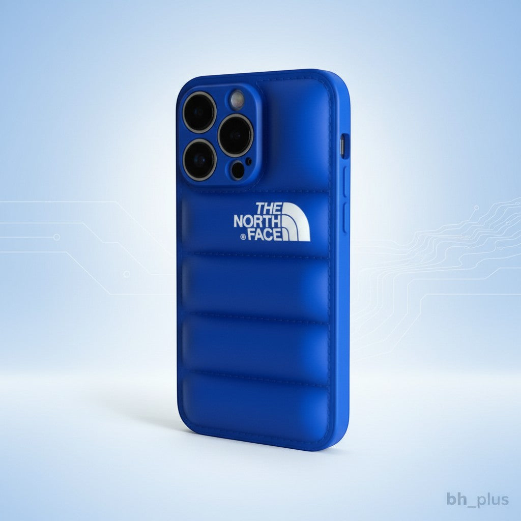 The North Face blue silicone iPhone case with quilted design and white logo. Protects against scratches and bumps.