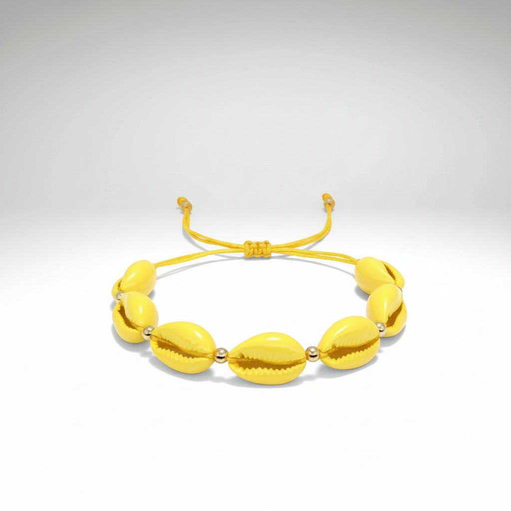 www.bhplus.shop yellow cowrie shell bracelet with gold bead accents and adjustable cord.