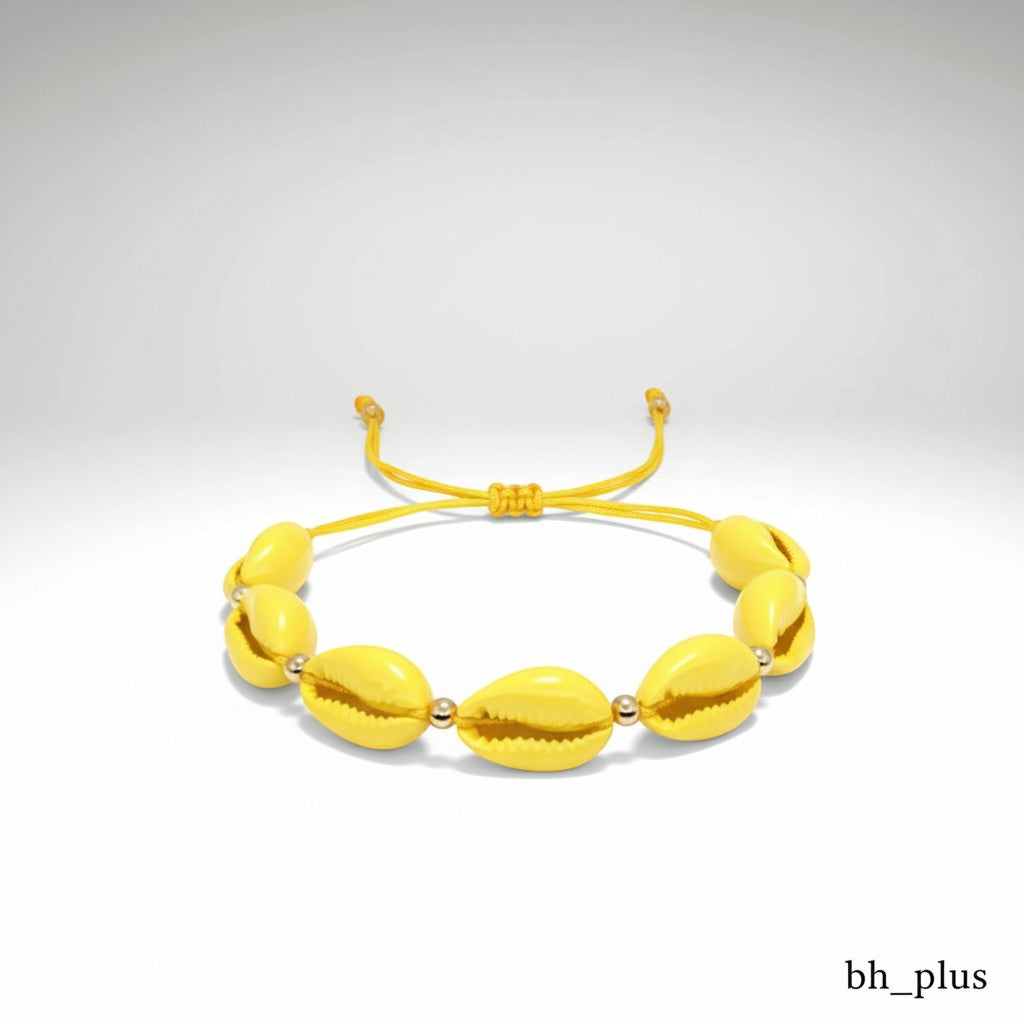 www.bhplus.shop yellow cowrie shell bracelet with gold bead accents and adjustable cord.