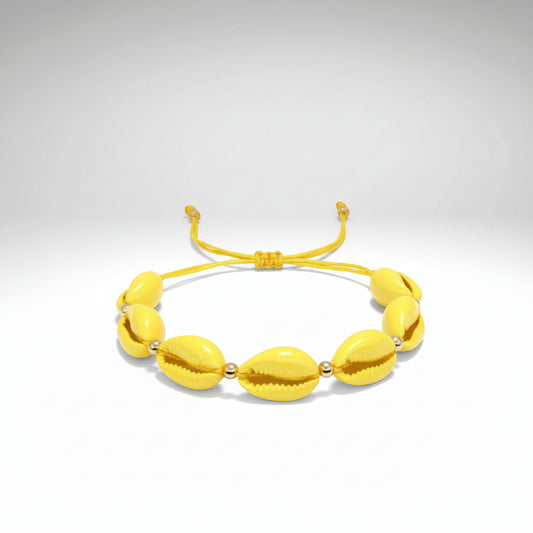 www.bhplus.shop yellow cowrie shell bracelet with gold bead accents and adjustable cord.