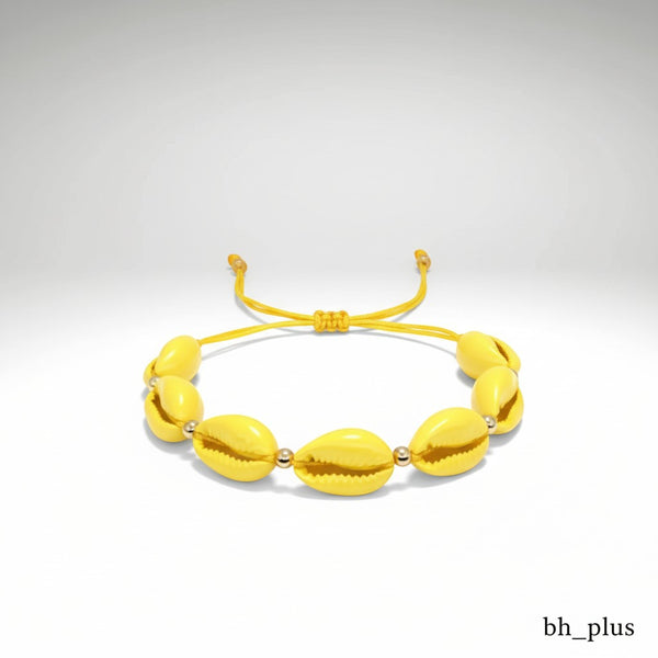 www.bhplus.shop yellow cowrie shell bracelet with gold bead accents and adjustable cord.